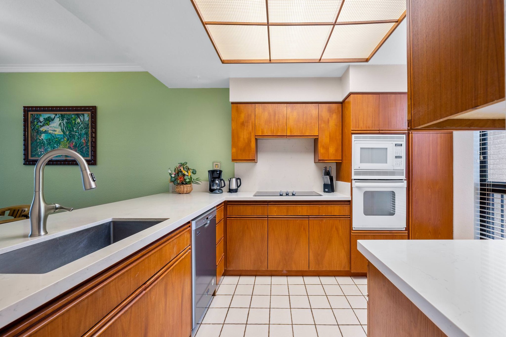 Kitchen with blender, drip coffee maker, kettle, toaster, and more