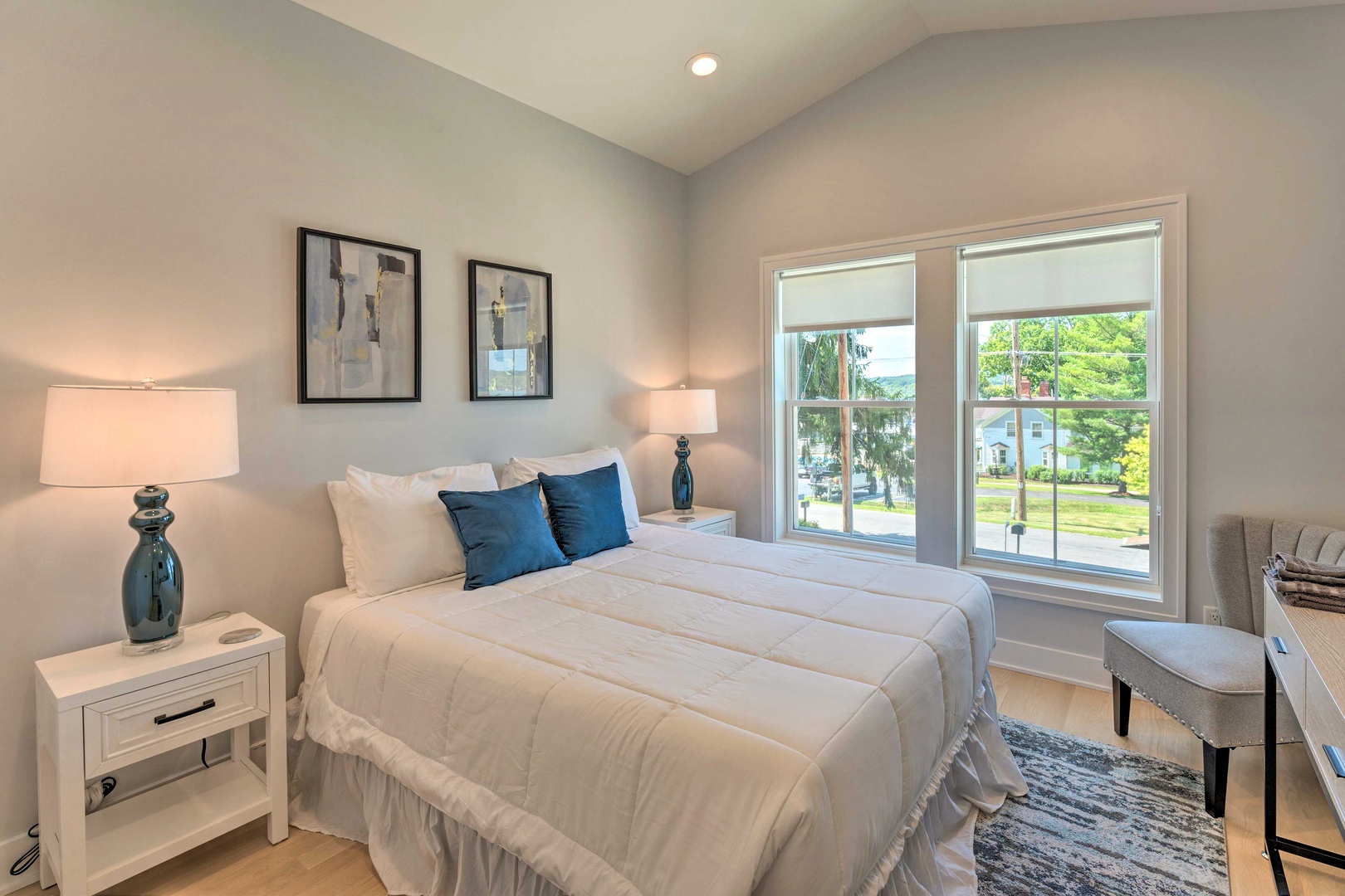 The final stylish bedroom includes a queen-sized bed & Smart TV