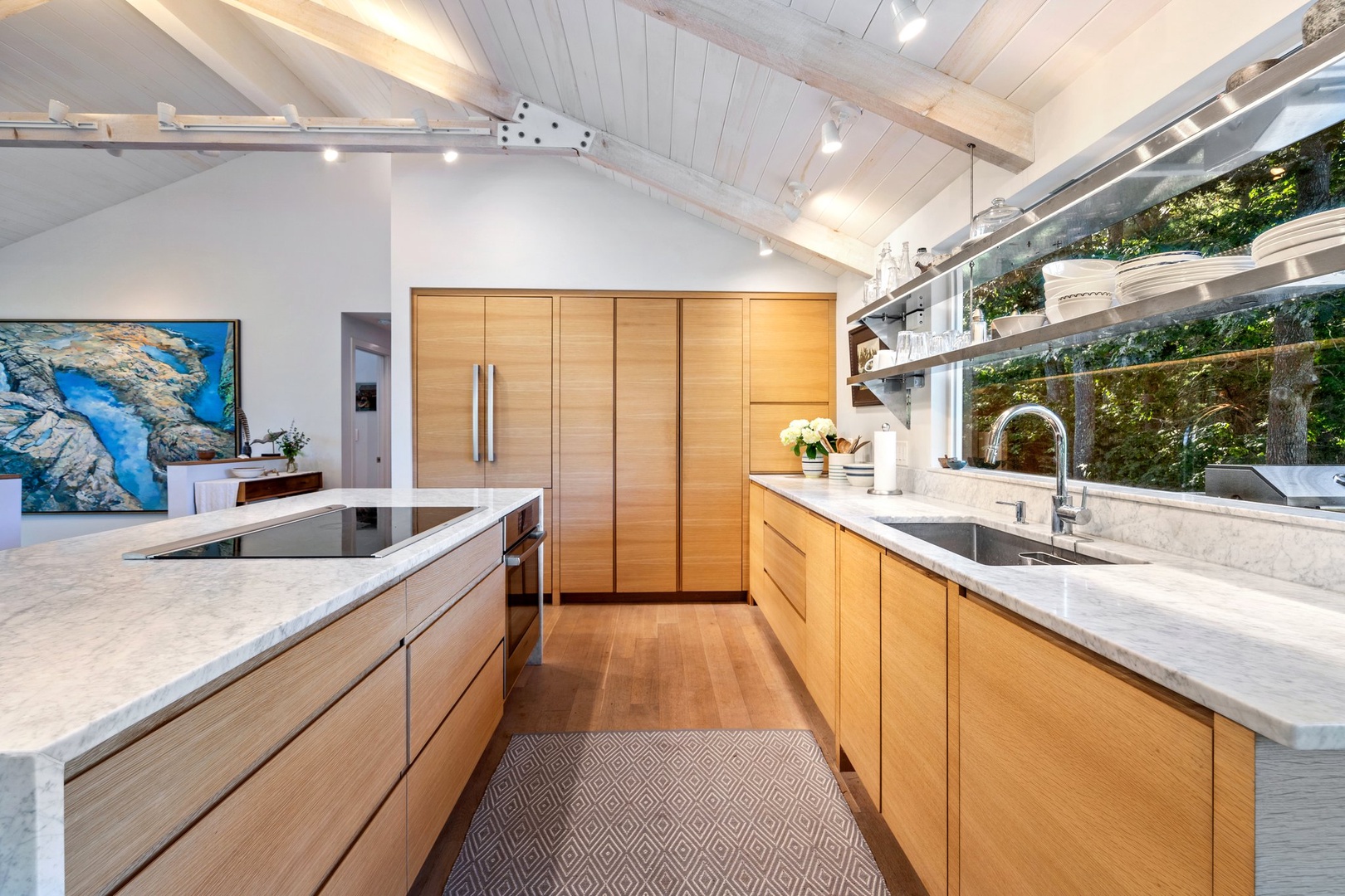 Modern elegance meets space and comfort in this inviting kitchen