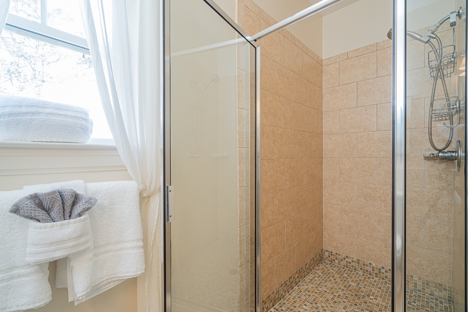 This 2nd floor ensuite bath offers a pedestal sink & glass shower