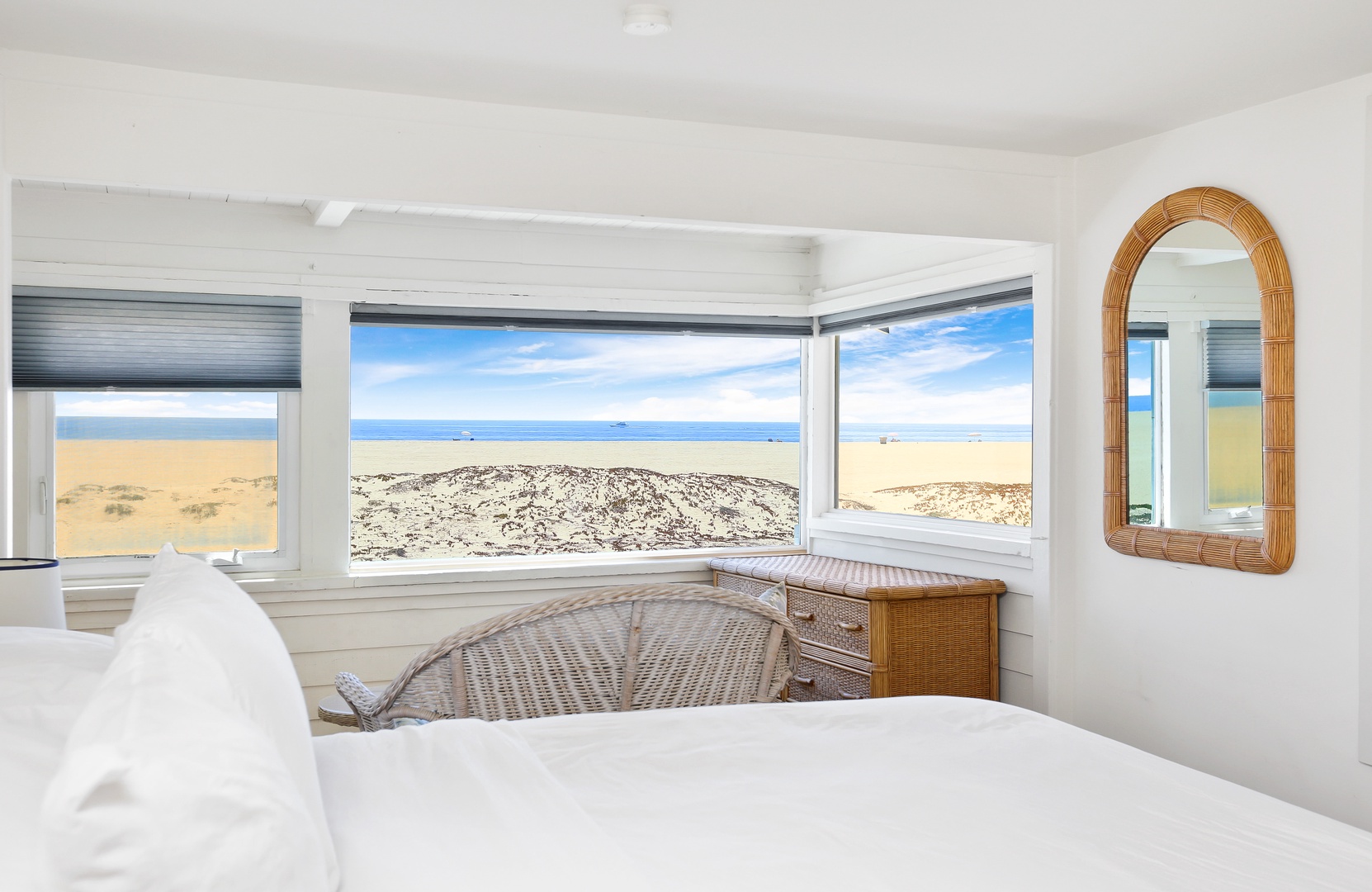 Bedroom #2 with king bed and seating area with views of the ocean