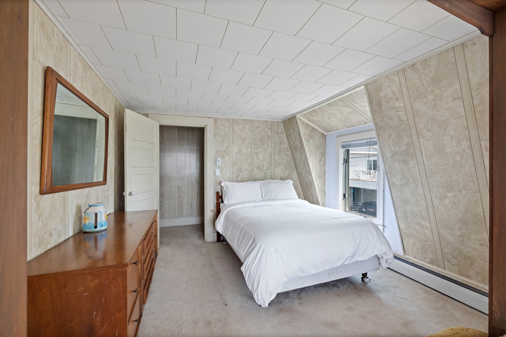 The 2nd bedroom, with a full-sized bed, a pair of twin beds, & twin-over-twin bunks