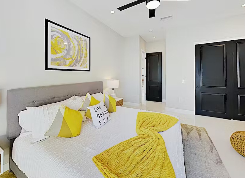 Spacious primary suite with king bed and luxury linens