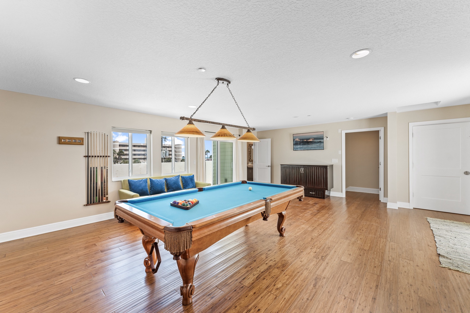 Game room with pool table, Smart TV, murphy bed, and dual decks