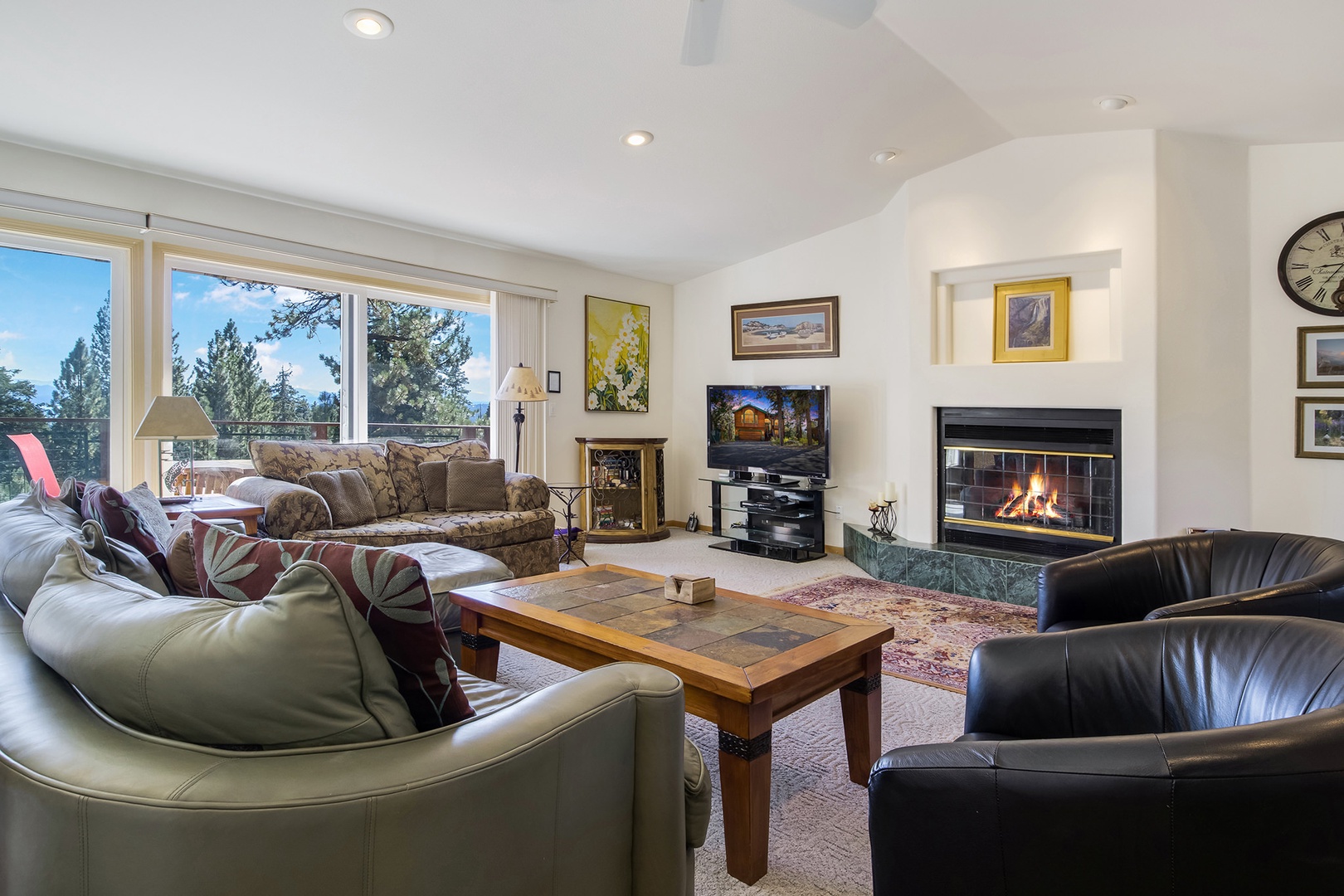 Bright living space with ample seating, fireplace, and Smart TV