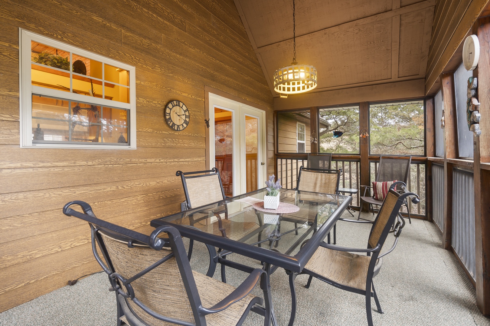 Back upper screened deck with outdoor seating, and mountain view