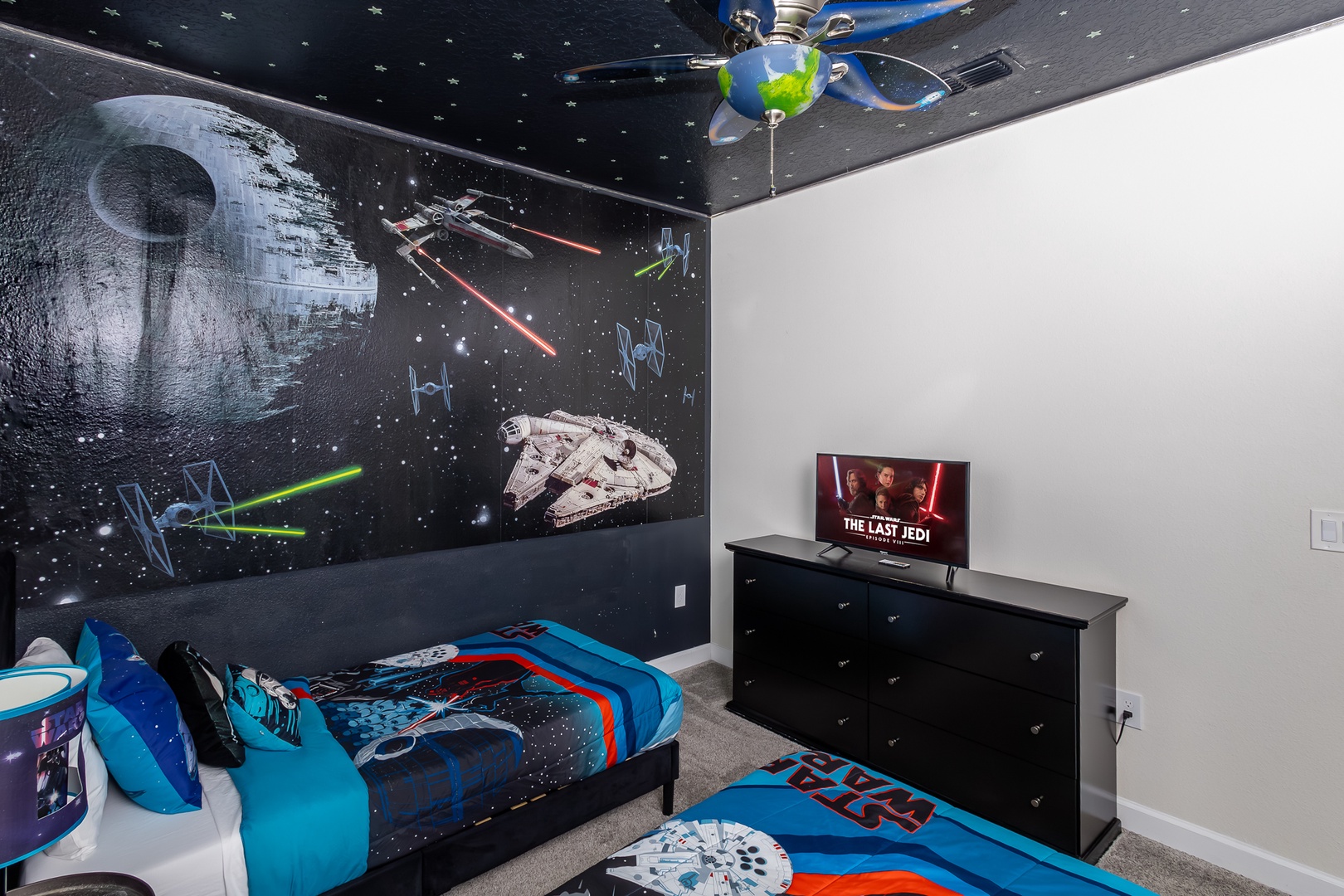 Feel the force in this 2nd-floor bedroom, offering two twin beds & a smart TV