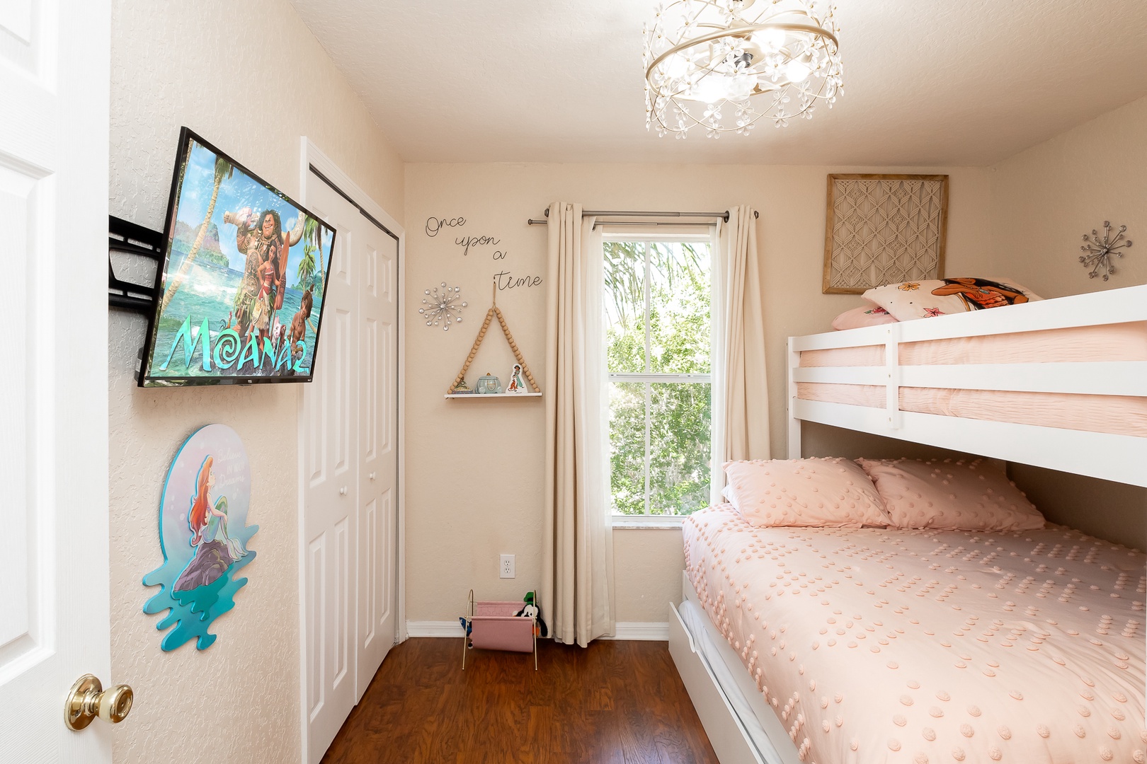 Drift into a nap in this bedroom’s twin-over-queen bunkbed with twin trundle