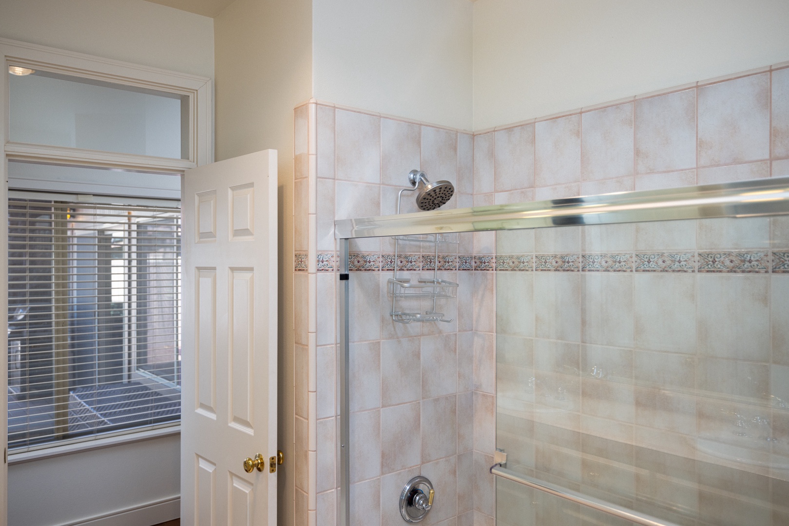 The 1st-floor ensuite bath features a double vanity & shower/tub combo