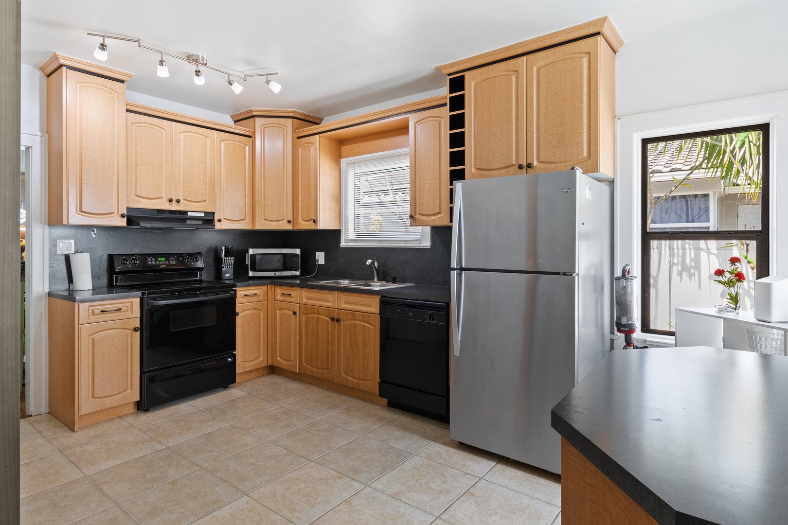 The warm, inviting kitchen offers ample space & all the comforts of home