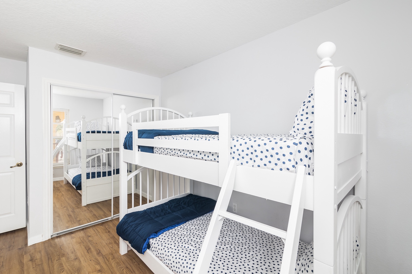 Take a snooze in this cozy twin bunk bed room