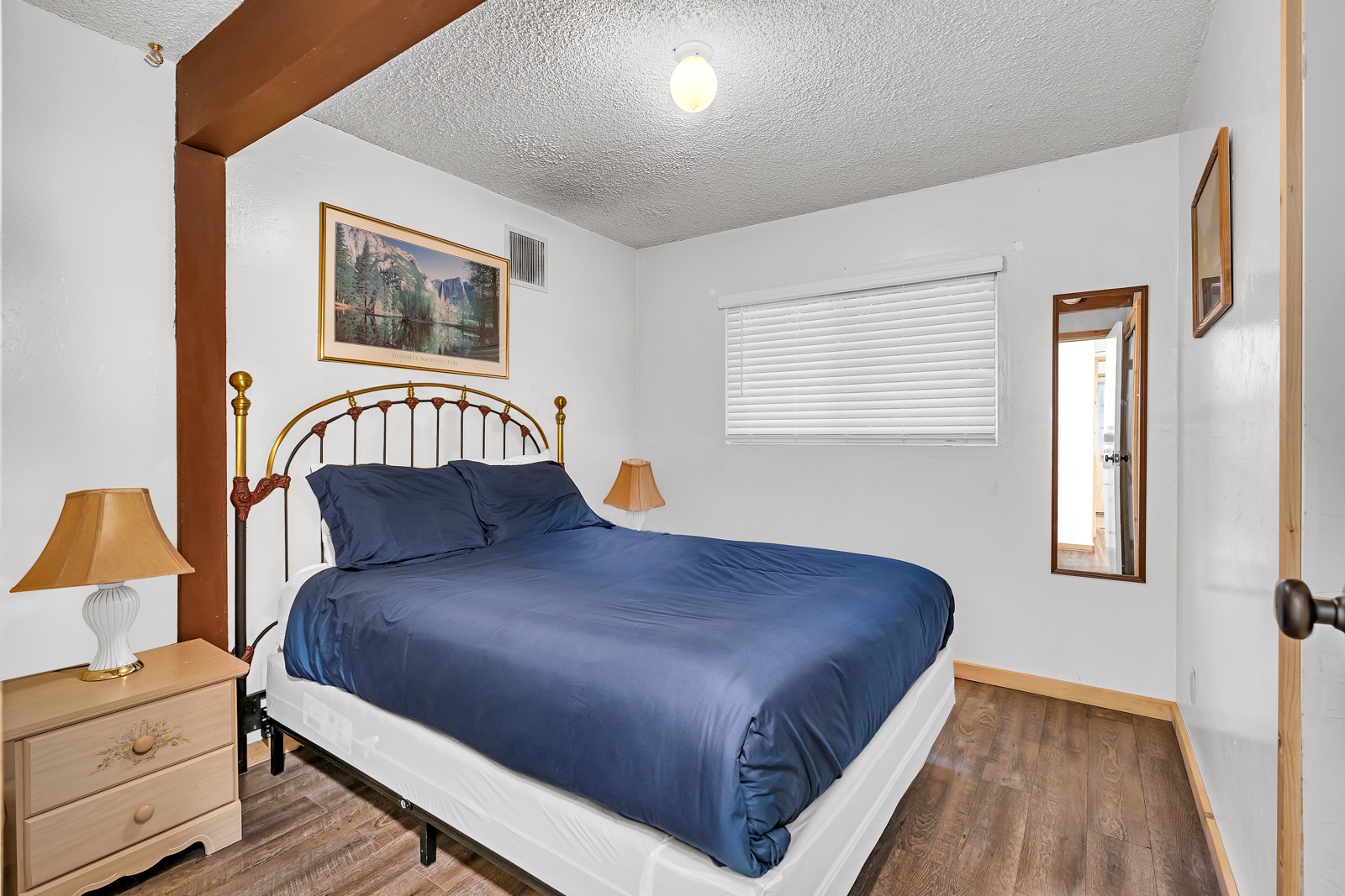 The second bedroom offers a regal queen-sized bed