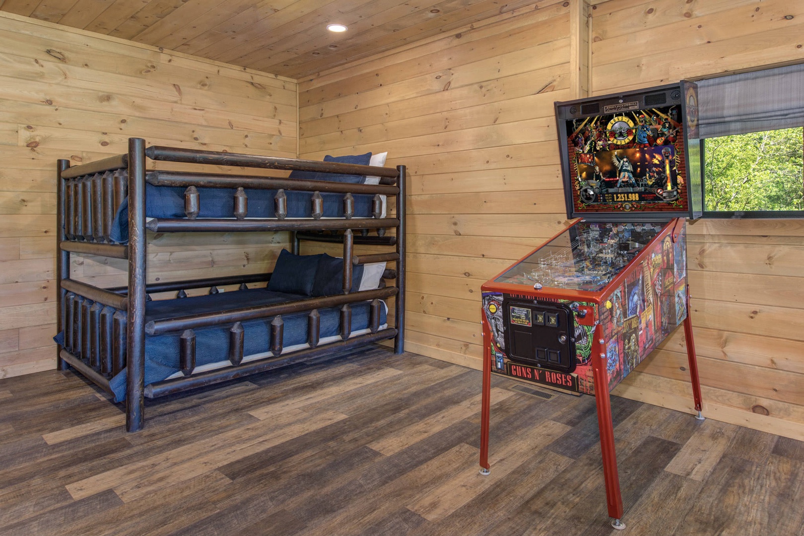Downstairs game room with queen over queen bunk beds