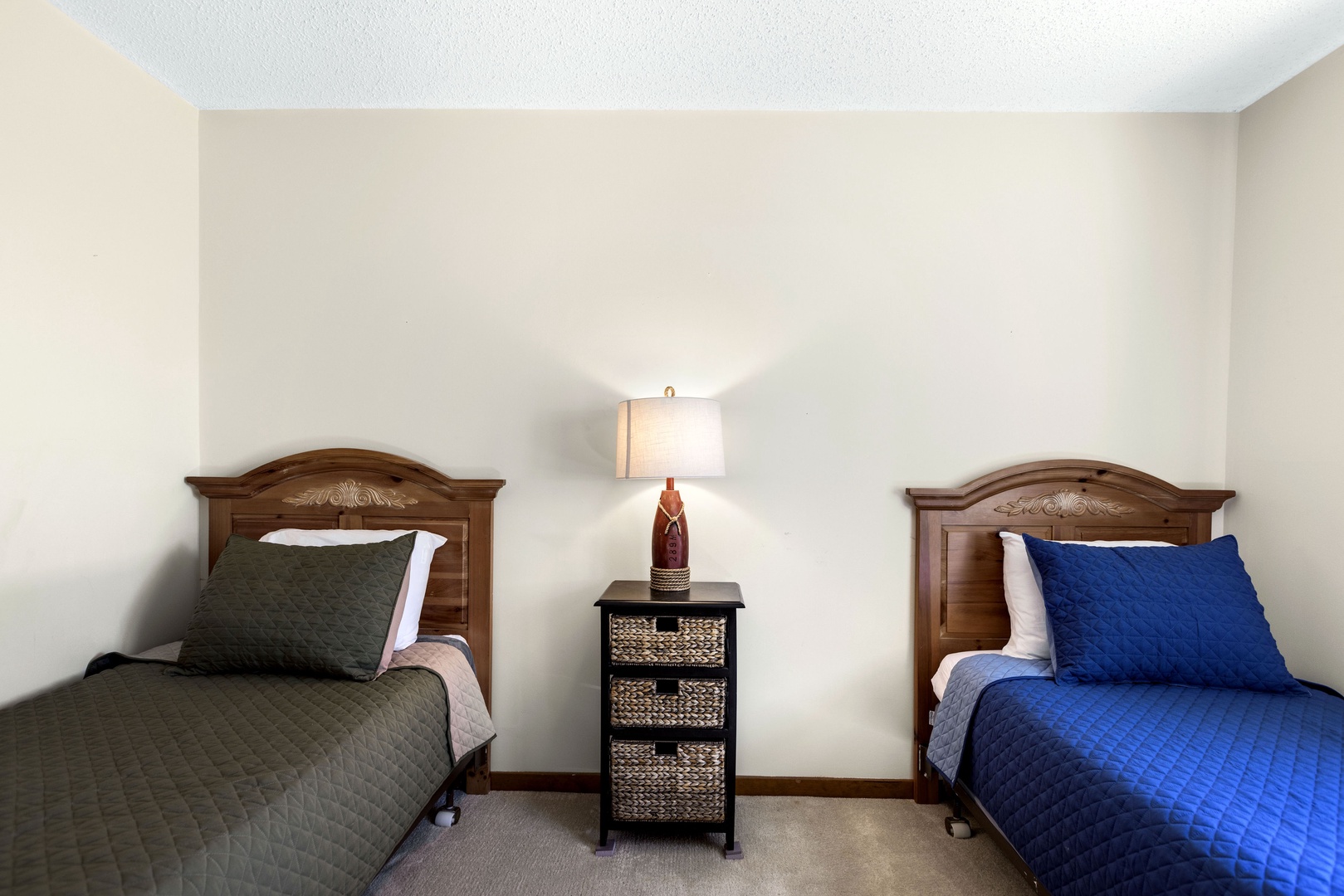 Unwind in the second bedroom, complete with two twin beds & TV