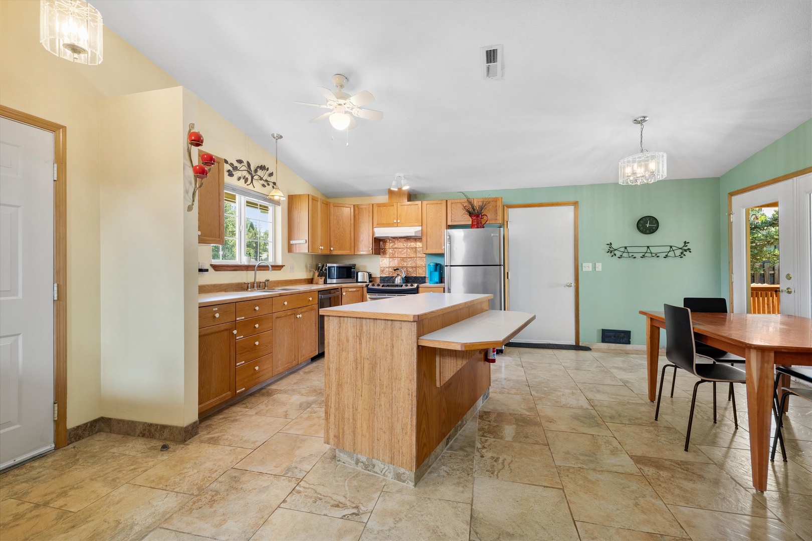 The open, breezy kitchen offers ample space & all the comforts of home