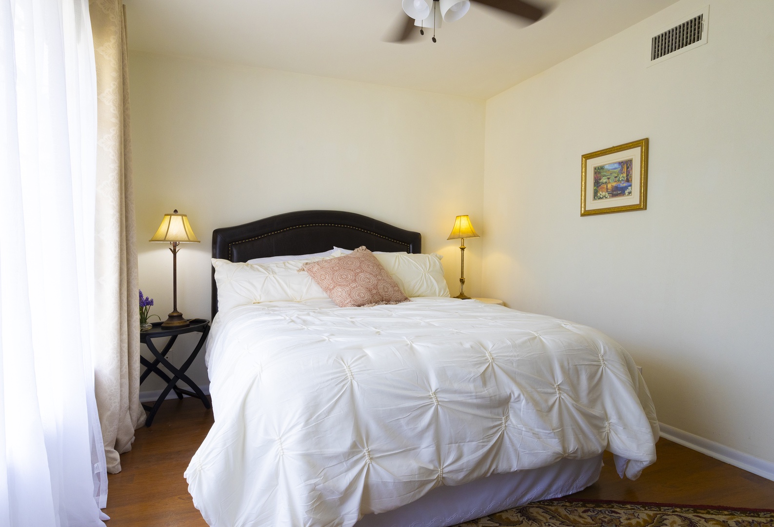 The second bedroom retreat features a plush queen bed & smart TV