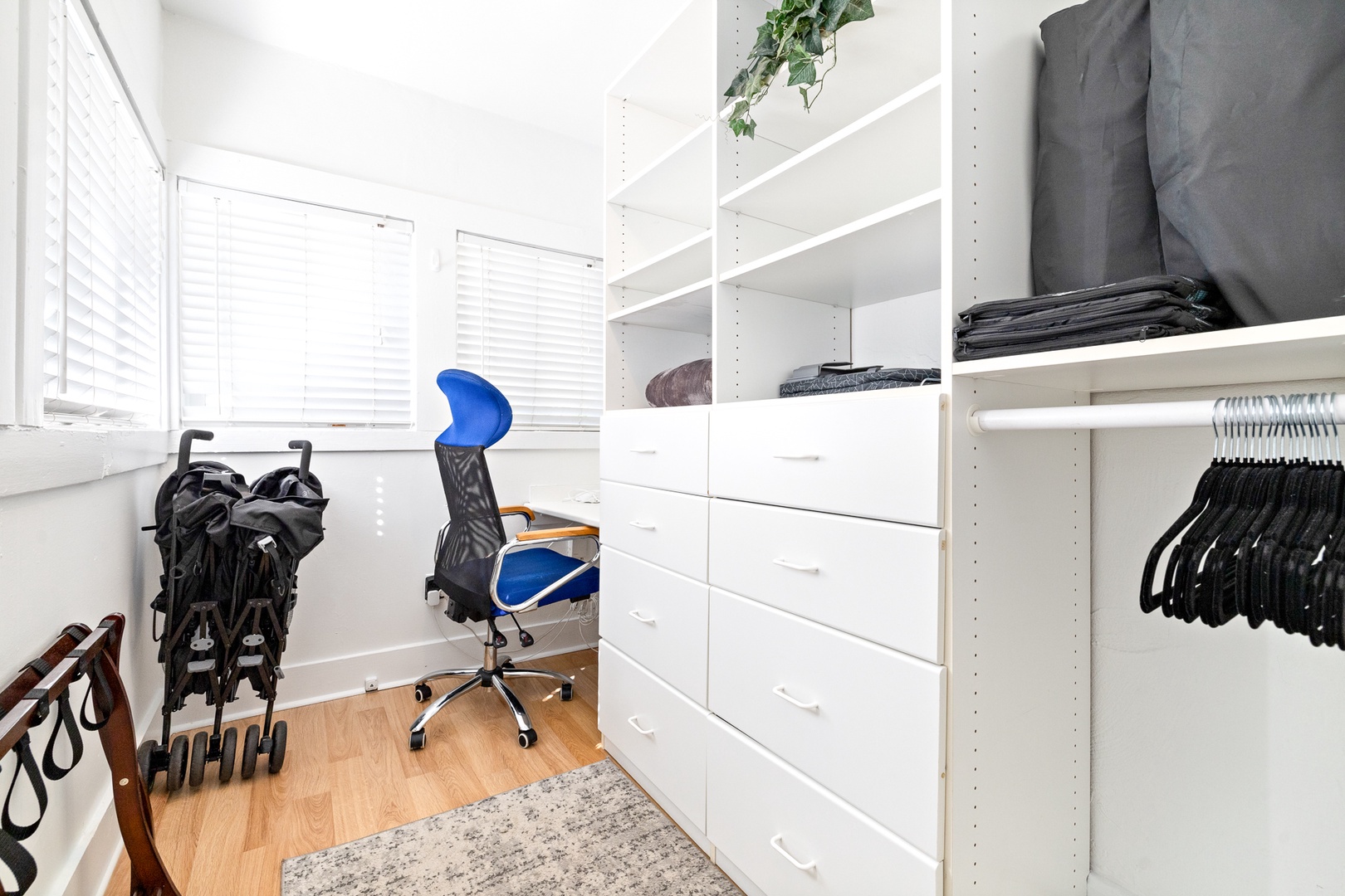 The master closet showcases loads of storage as well as a convenient desk