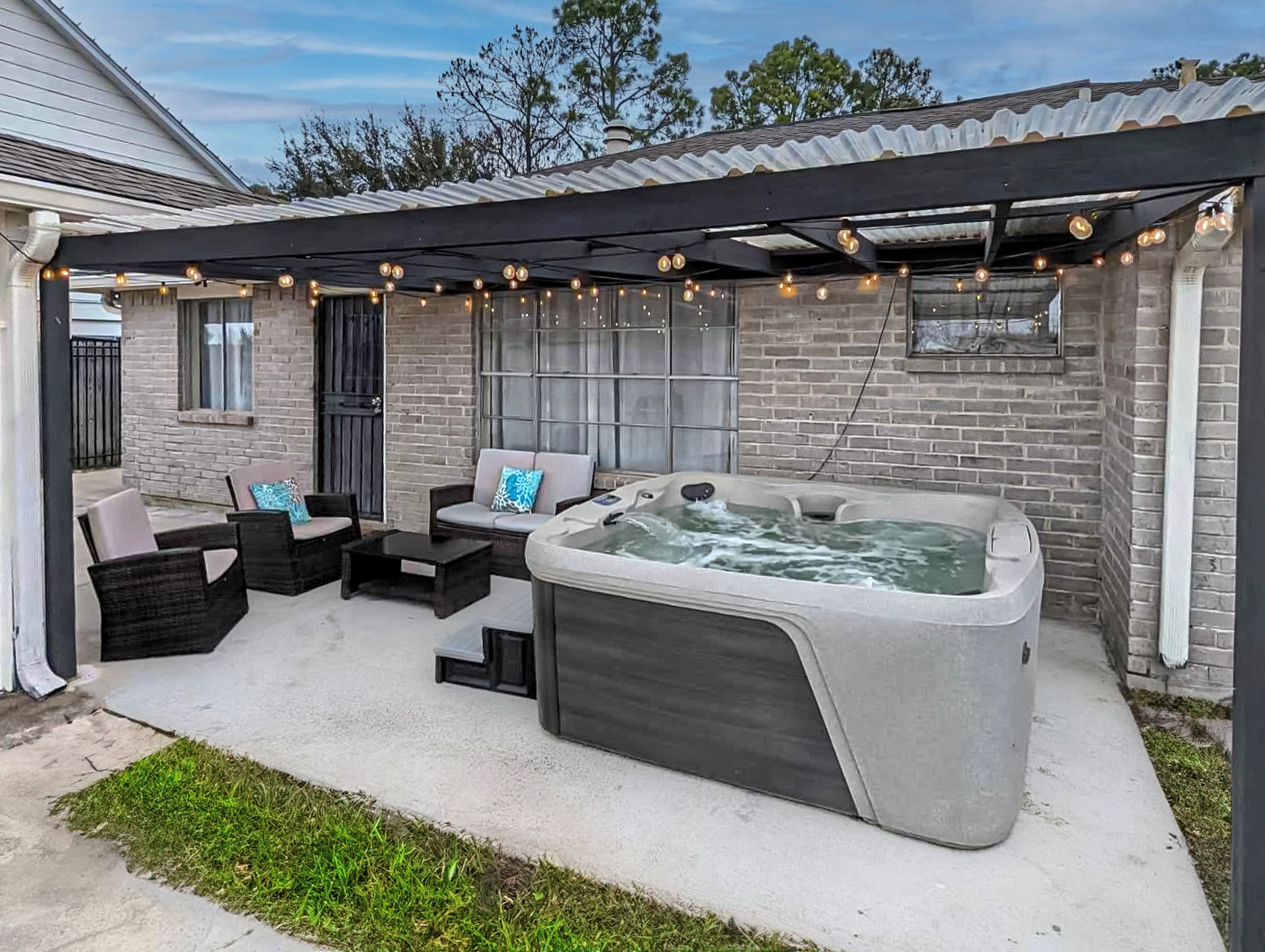 Lounge the day away or soak in the private hot tub on the serene patio