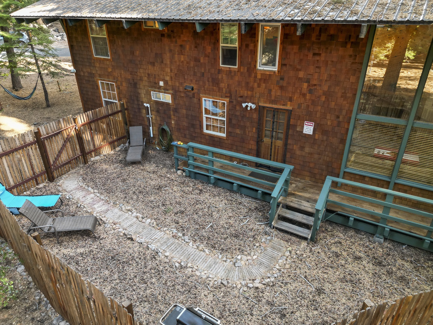 Backyard with seating and gas BBQ grill