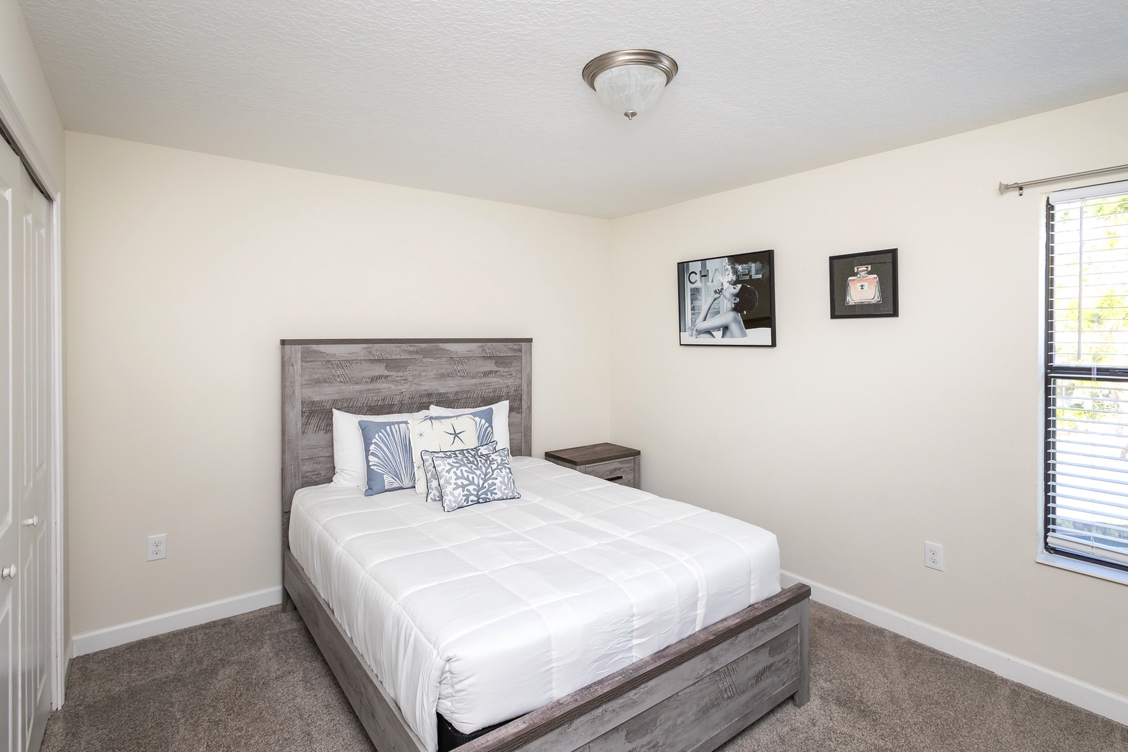 This cozy bedroom retreat features a comfortable queen-size bed & smart TV