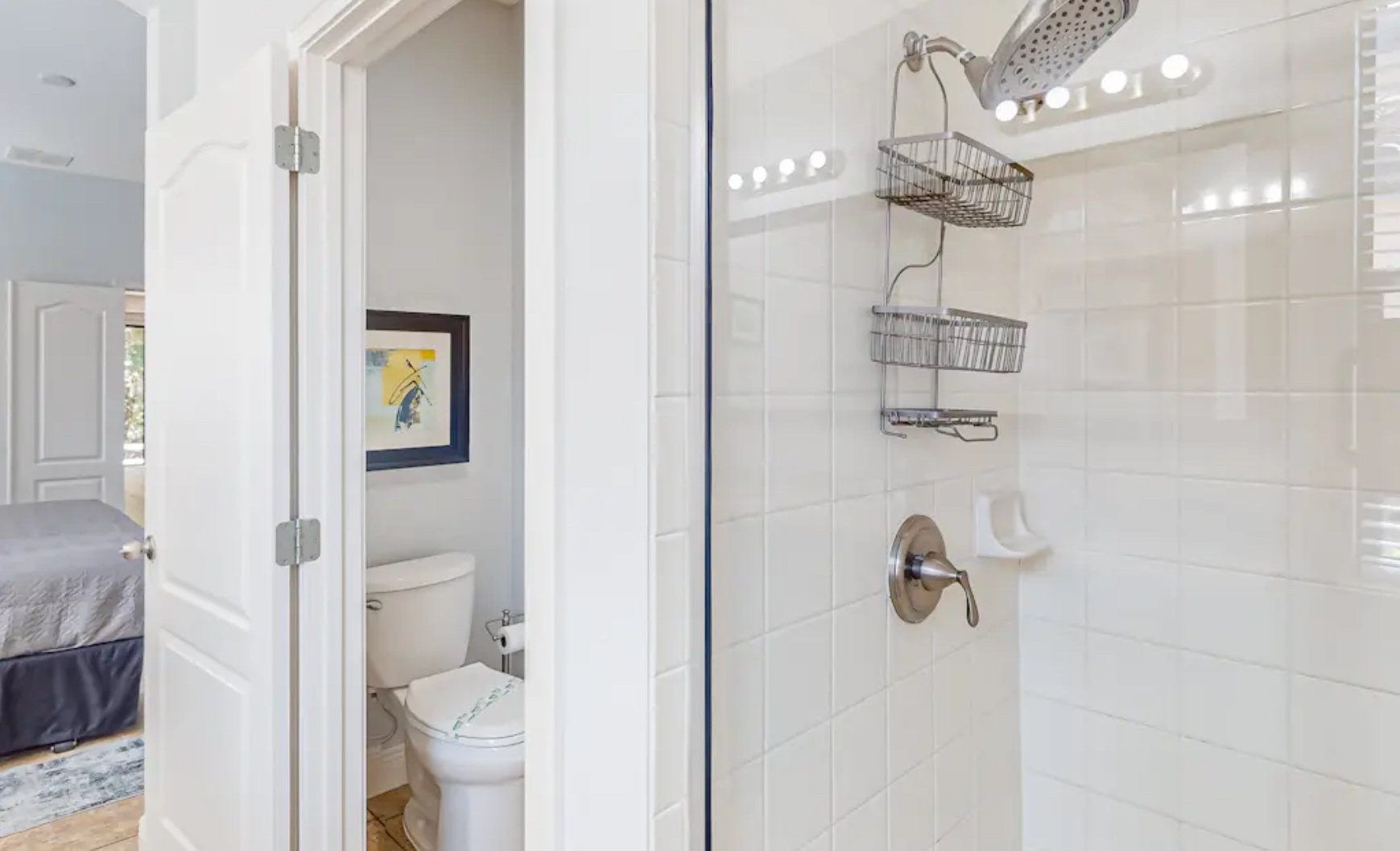 A double vanity & glass shower await in this 1st-floor ensuite