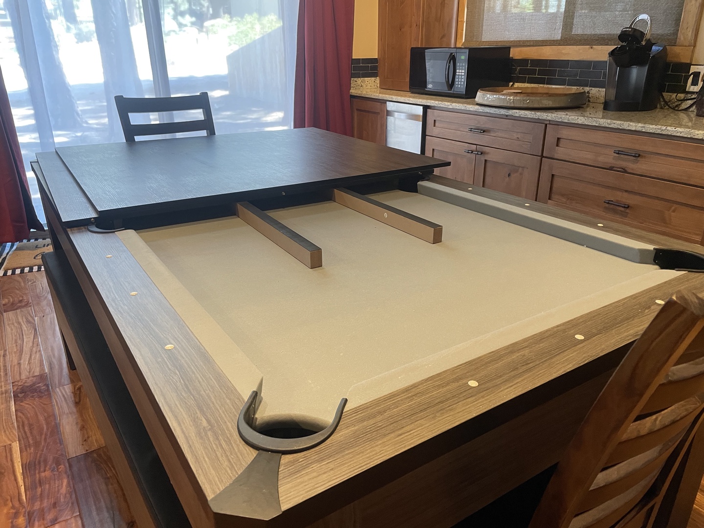 Dining table converts to a pool table!