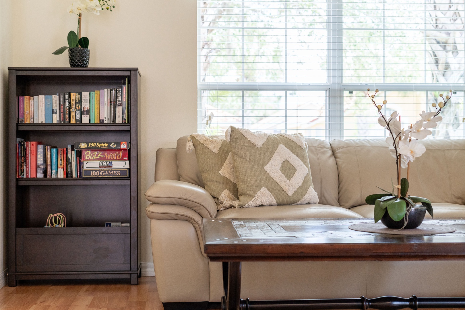 Front living room with a full-size sleeper sofa and dining area for 6