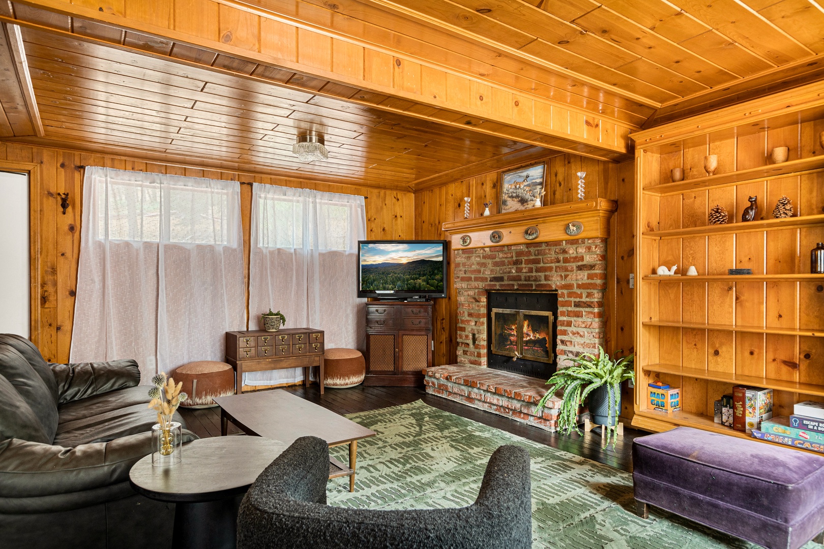 Living area with ample seating, Smart TV, and fireplace