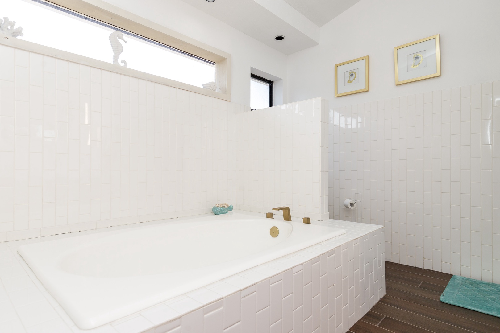 The king en suite offers a large single vanity, shower, & luxurious soaking tub
