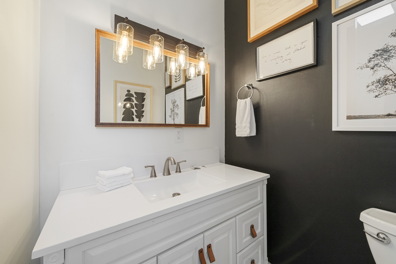 A single vanity & shower/tub combo await in the full bath