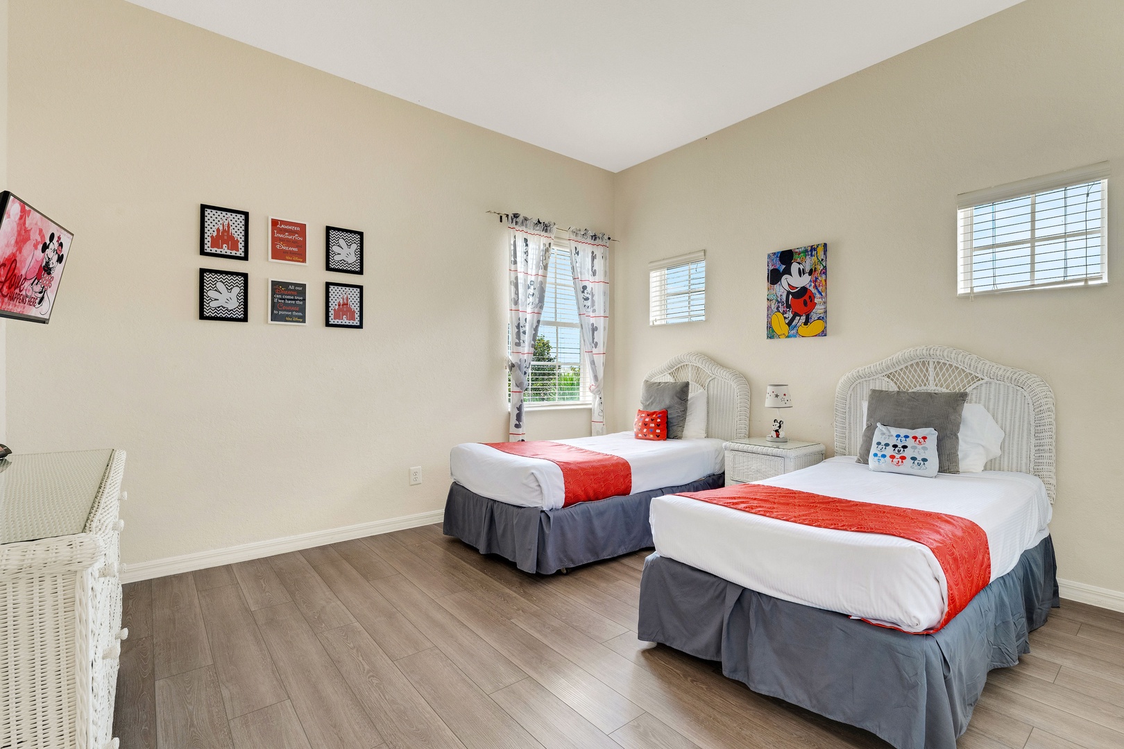 A pair of cozy twin beds & TV await in the final bedroom retreat