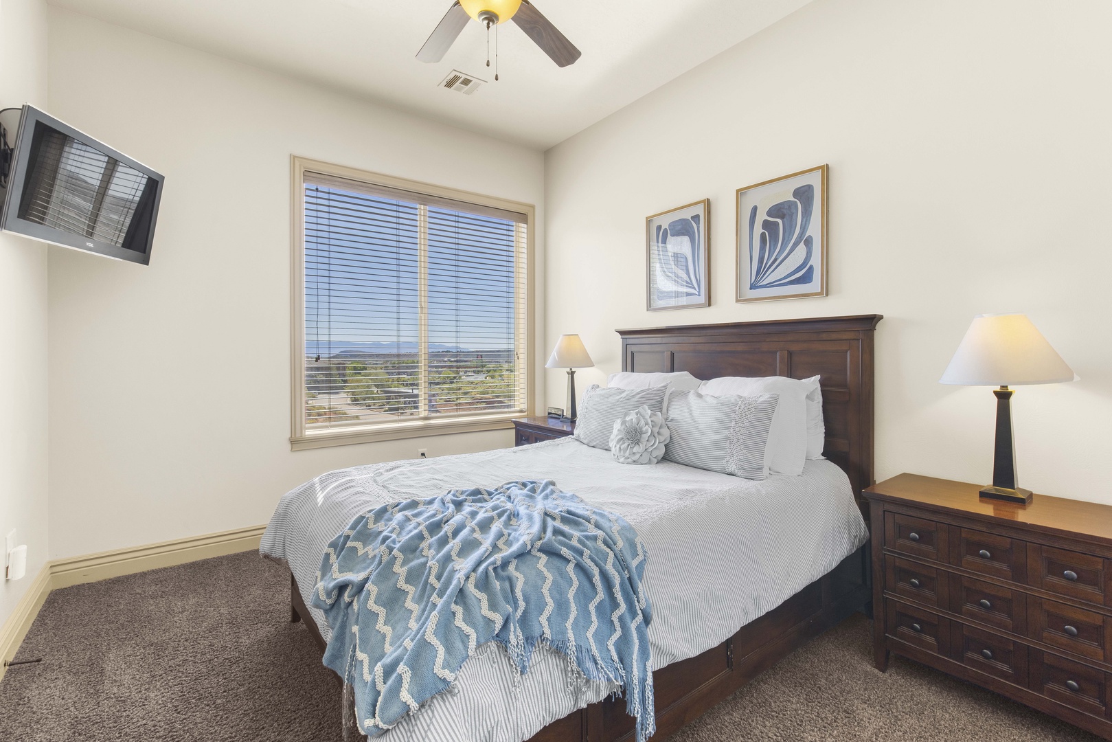 This comfortable queen bedroom offers a Smart TV & stunning view