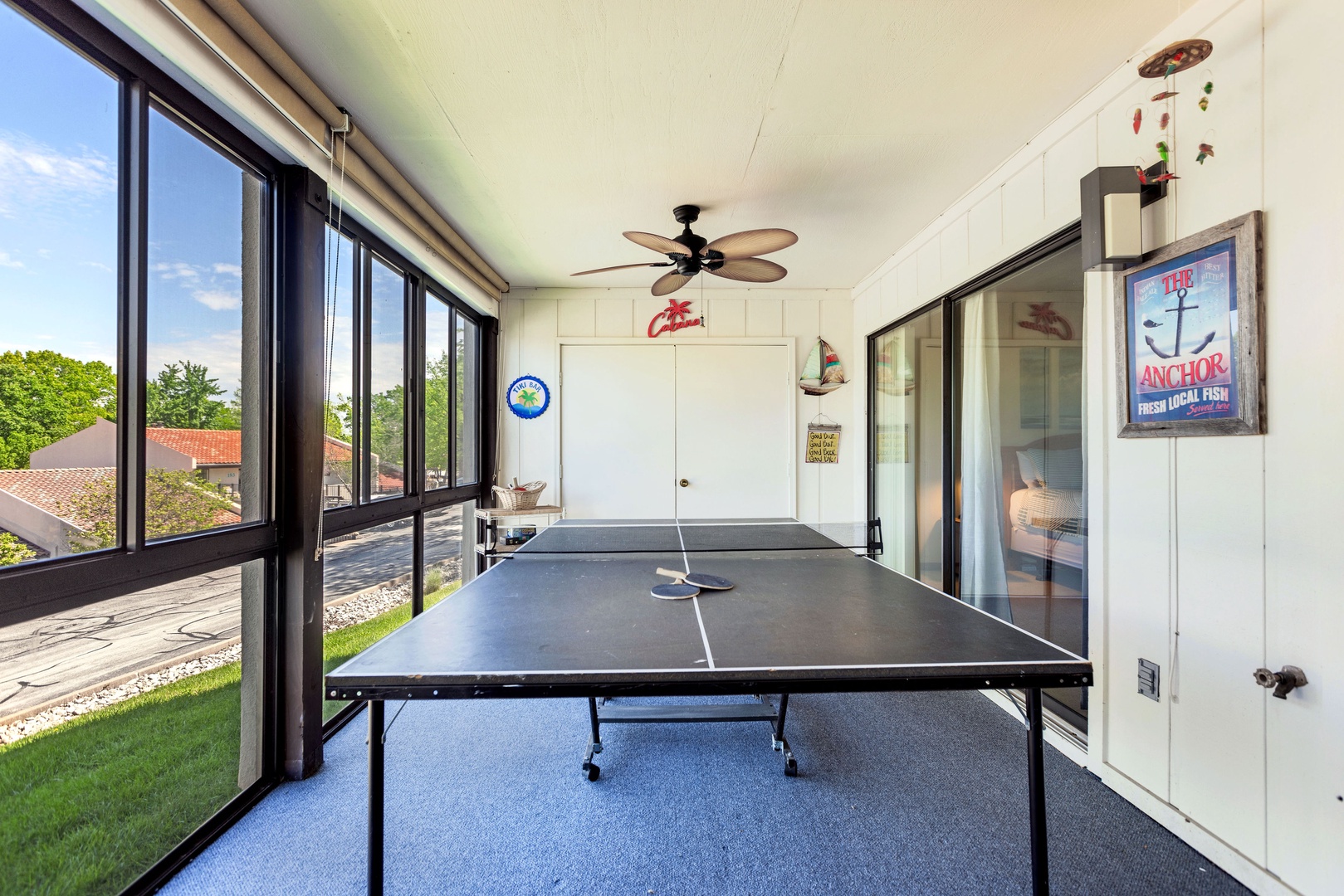 Game on! The 3-seasons deck boasts a ping pong table & ample seating