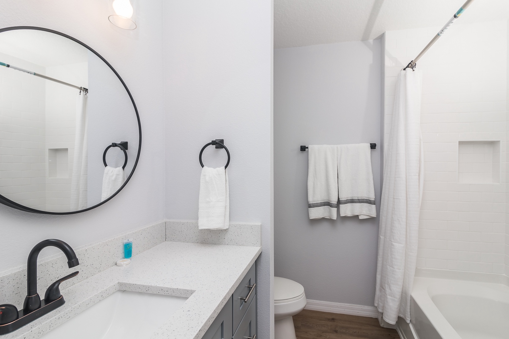 Wash up with this full bath’s single vanity & shower/tub combo