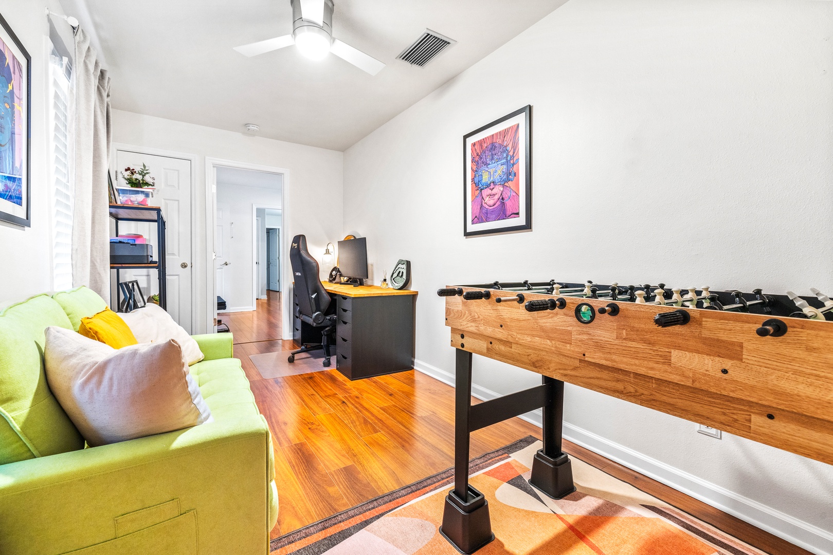 Game room with sofa sleeper, foosball, and shared ensuite