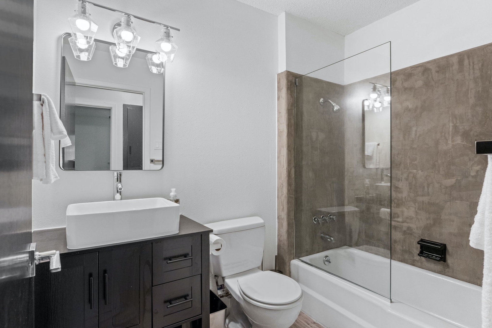 The second full bathroom offers a single vanity & shower/tub combo