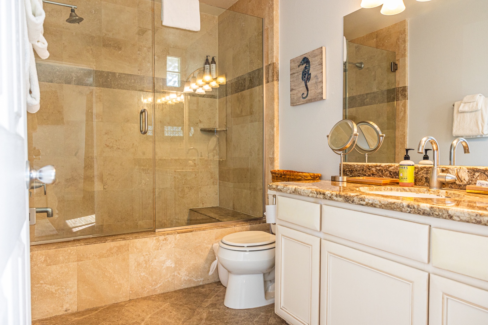 Wash up in the king ensuite, featuring a single vanity & shower/tub combo