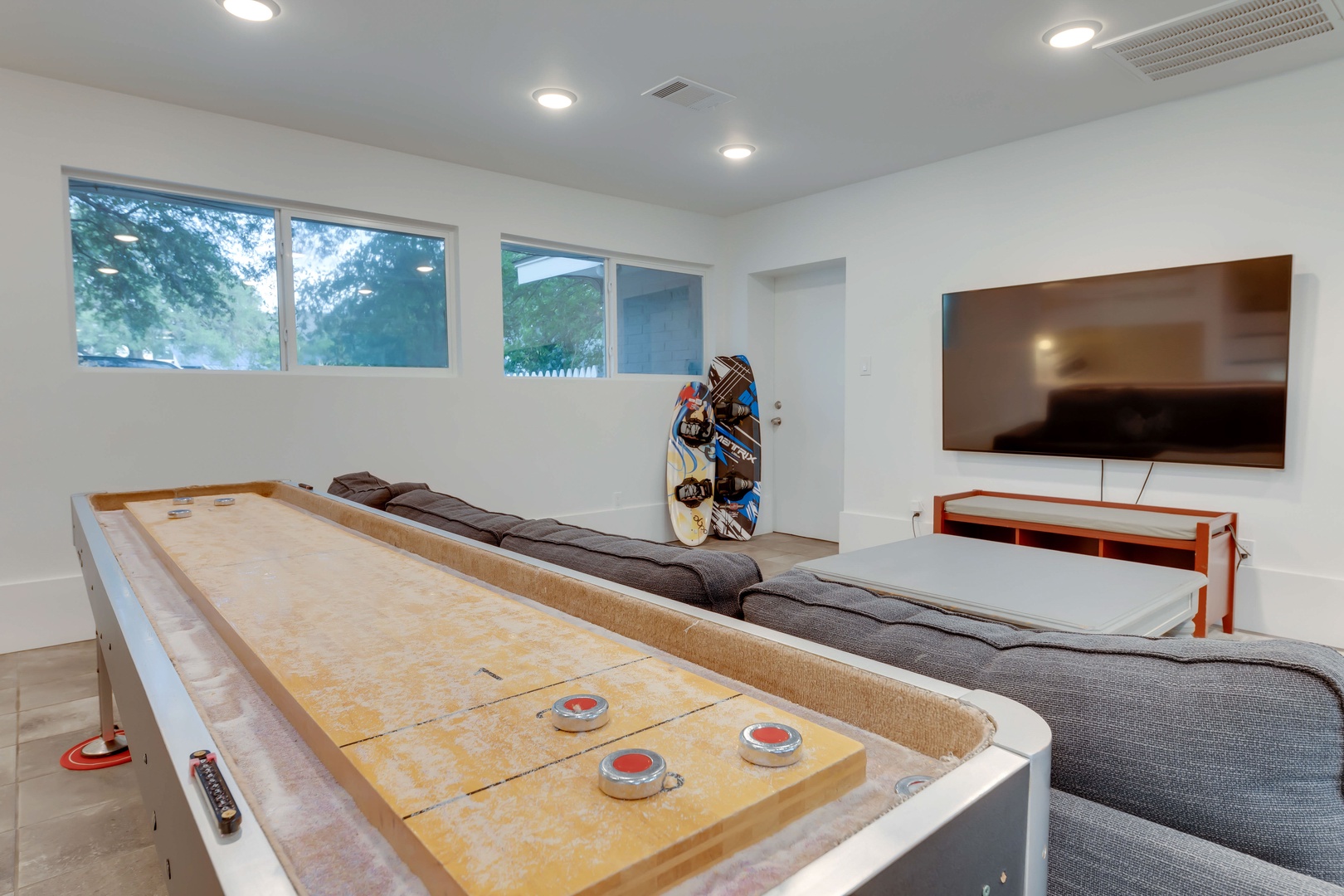 The 2nd bedroom/tv room boasts 6 full bunks, Smart TV, & shuffleboard table