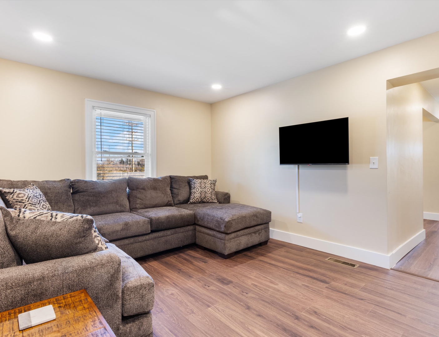 Second living room with lush seating and Smart TV