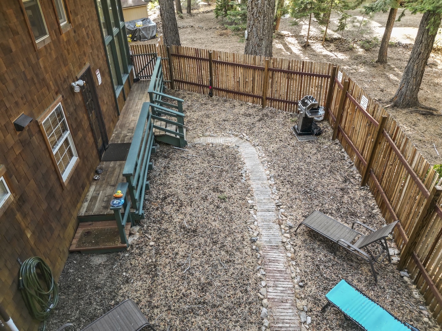 Backyard with seating and gas BBQ grill