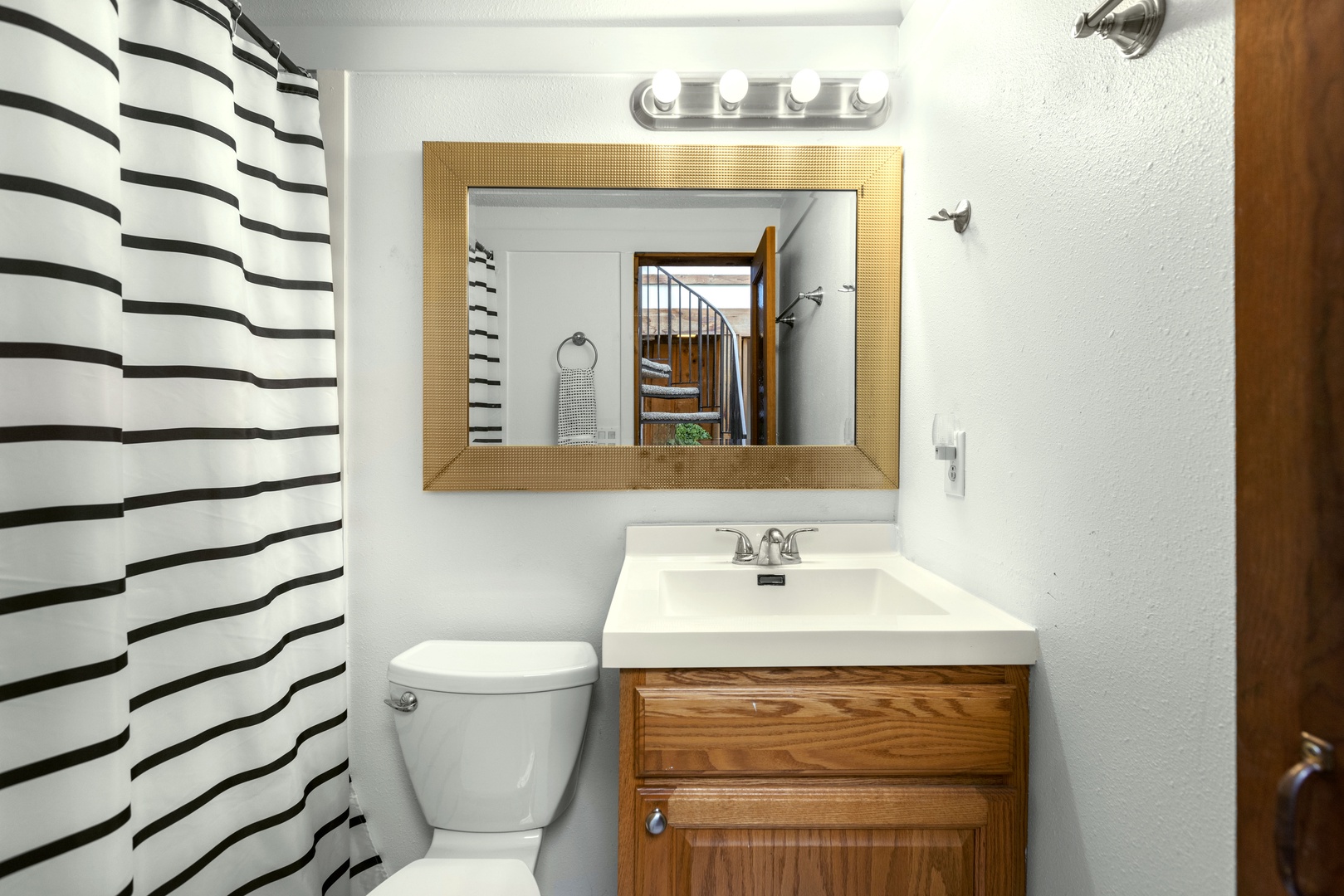 A single vanity & walk-in shower await in this full bathroom