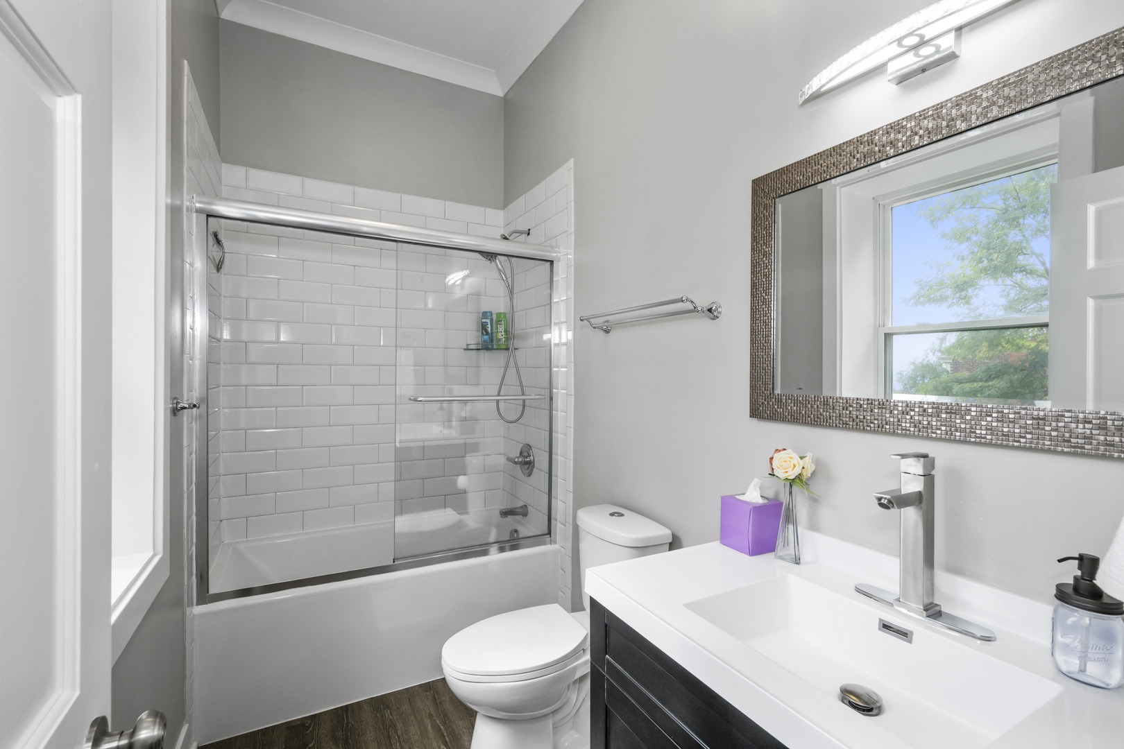 The 3rd bedroom en suite includes a single vanity & shower/tub combo