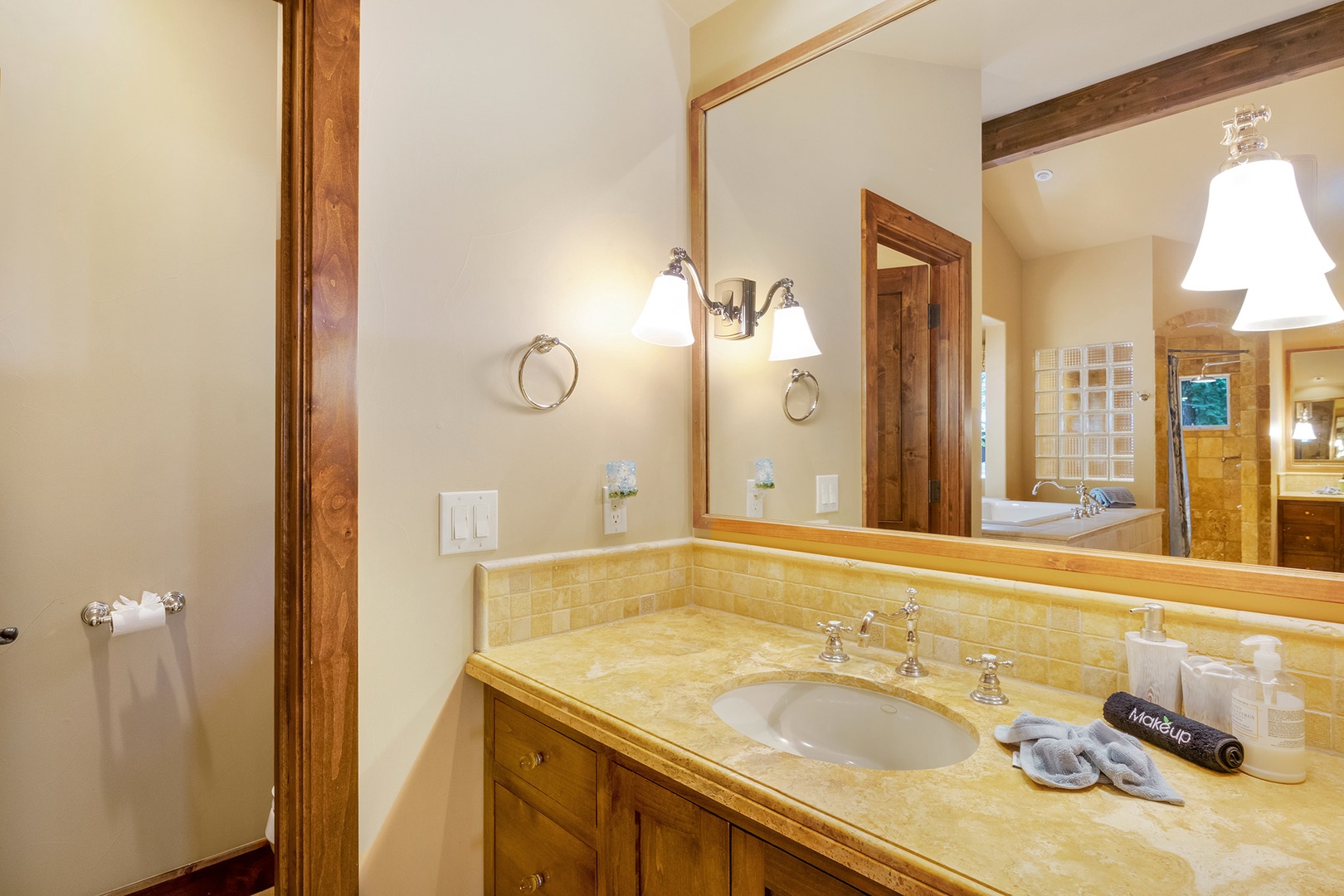 Ensuite bathroom with vanity, stand-up shower, and soaking tub