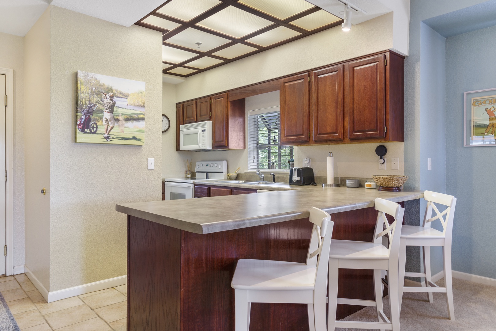 Kitchen has additional bar stool seating