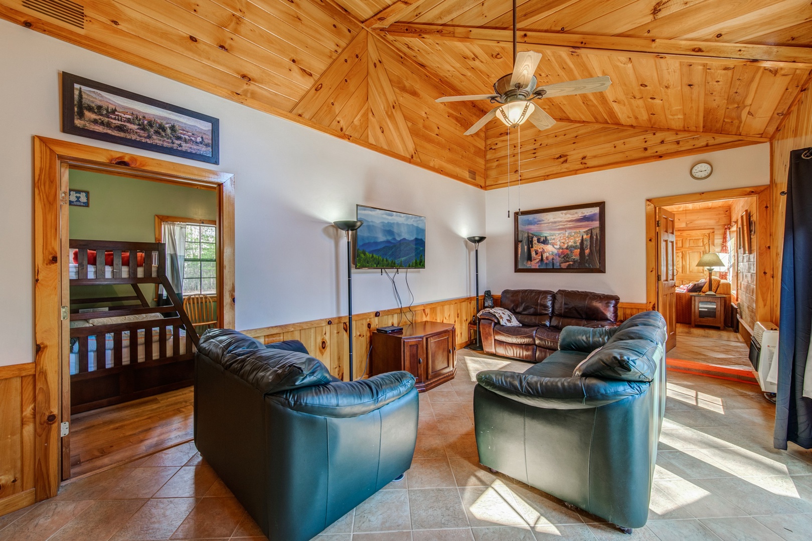 Enjoy plush seating and soaring wood ceilings while kicking back to enjoy a movie in the Living Area