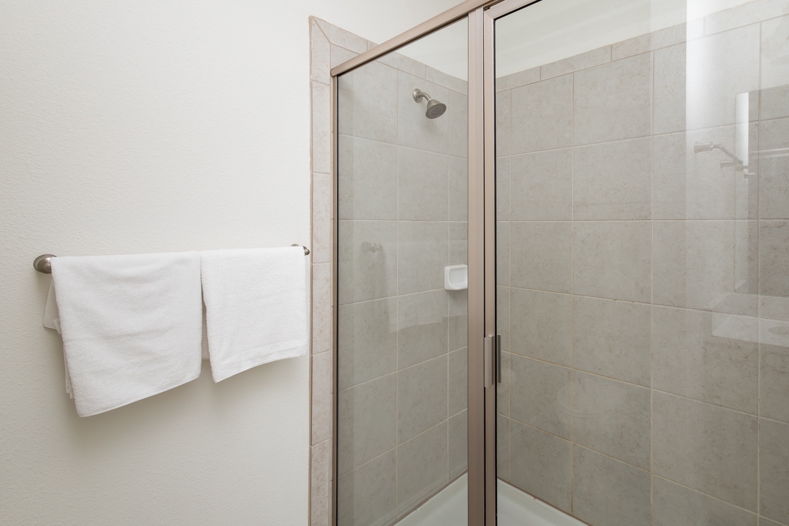 Private bathroom with dual vanity and  walk-in shower ensuite to 2nd floor king bedroom