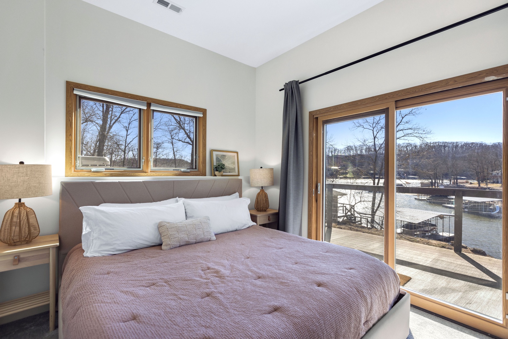 The final bedroom offers a plush king bed & deck access