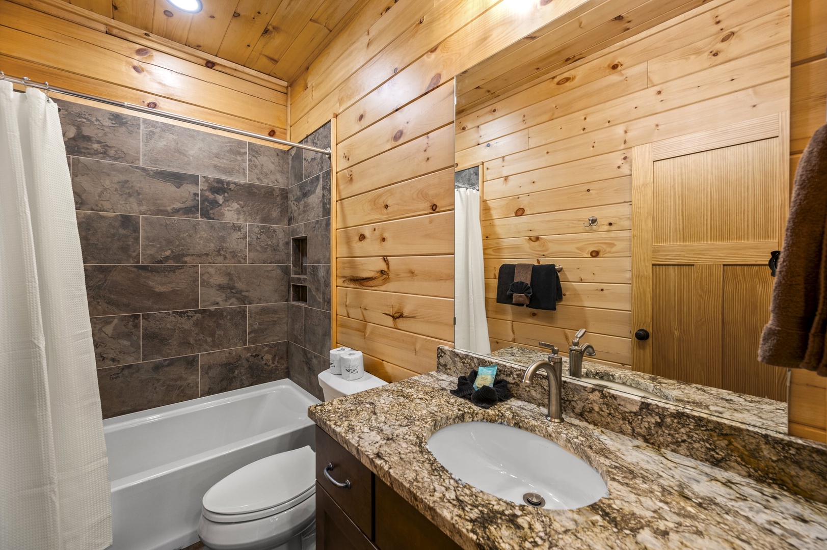 Shared bathroom with shower/tub combo