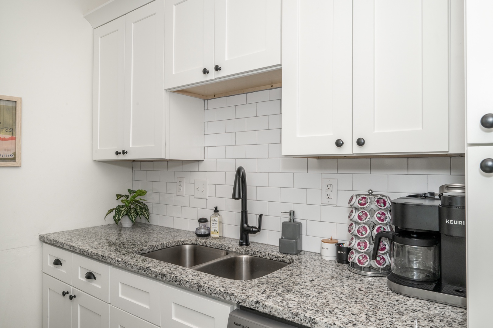 Apt 2 – The modern kitchen offers ample storage & all the comforts of home