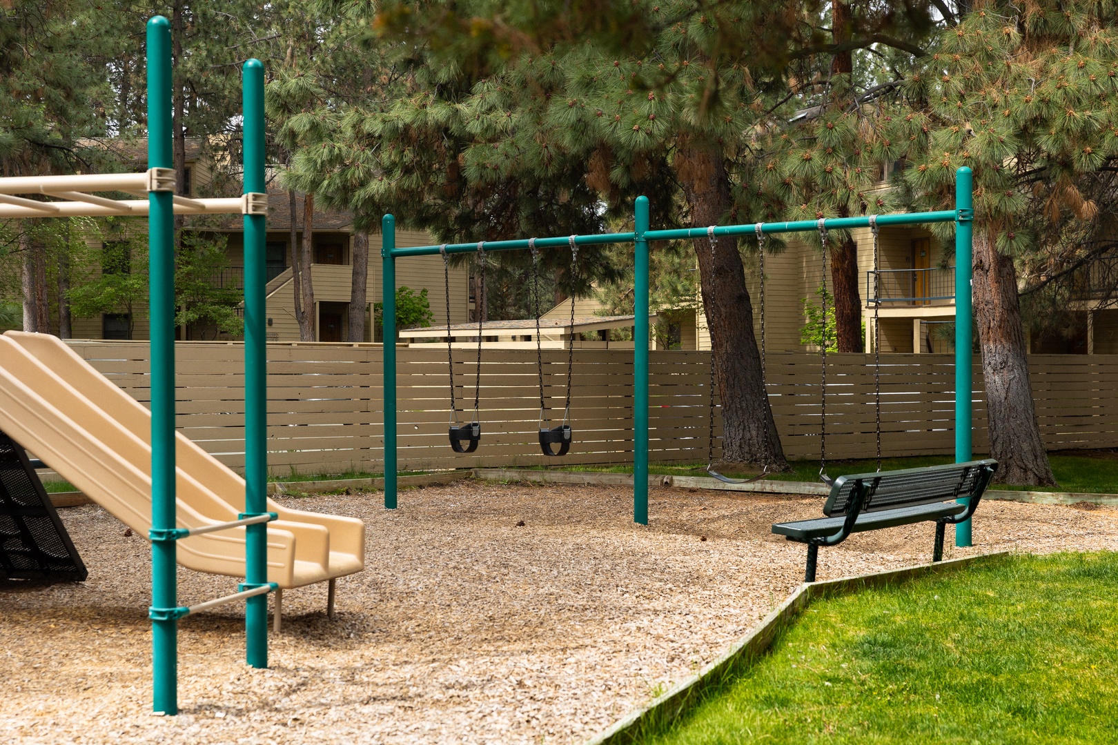 A serene playground nestled among lush trees, perfect for family fun